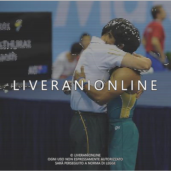 SHENZHEN, Aug. 16, 2011 Prashanth Sellathurai of Australia celebrates with his coach after winning the men\'s pommel horse final of artistic gymnastics event at the 26th Summer Universiade, in Shenzhen, a city of south China\'s Guangdong Province, Aug. 16, 2011. Sellathurai won the gold medal with 15.700 points. (/Lin Yiguang)(bxf)