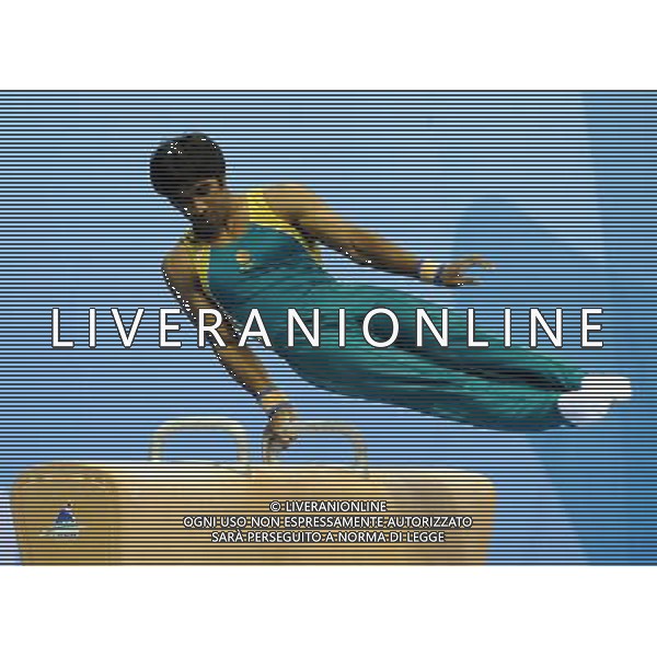 SHENZHEN, Aug. 16, 2011 Prashanth Sellathurai of Australia competes during the men\'s pommel horse of artistic gymnastics event at the 26th Summer Universiade, in Shenzhen, a city of south China\'s Guangdong Province, Aug. 16, 2011. Prashanth Sellathurai won the gold medal with 15.700 points. (/Lin Yiguang)(bxf)