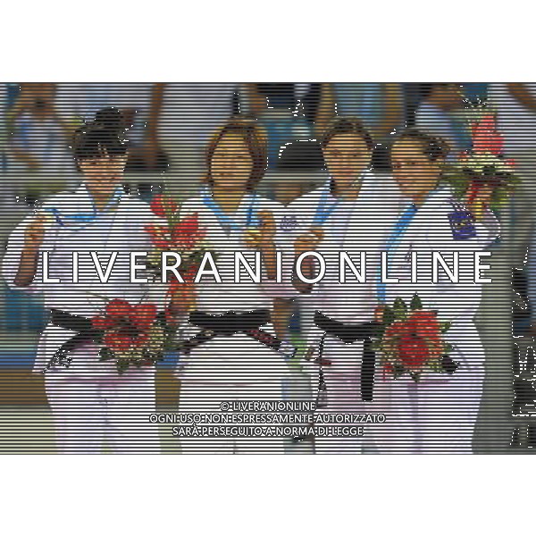 SHENZHEN, Aug. 16, 2011 Gold medalist Kaori Kondo of Japan (C), silver medalist Kristina Rumyantseva of Russia, bronze medalists Violeta Dumitru of Romania and Aurore Climence of France pose for group photos during the awarding ceremony of women\'s Judo 48KG event at the 26th Summer Universiade in Shenzhen, a city of south China\'s Guangdong Province, Aug. 16, 2011. (/Liu Dawei)