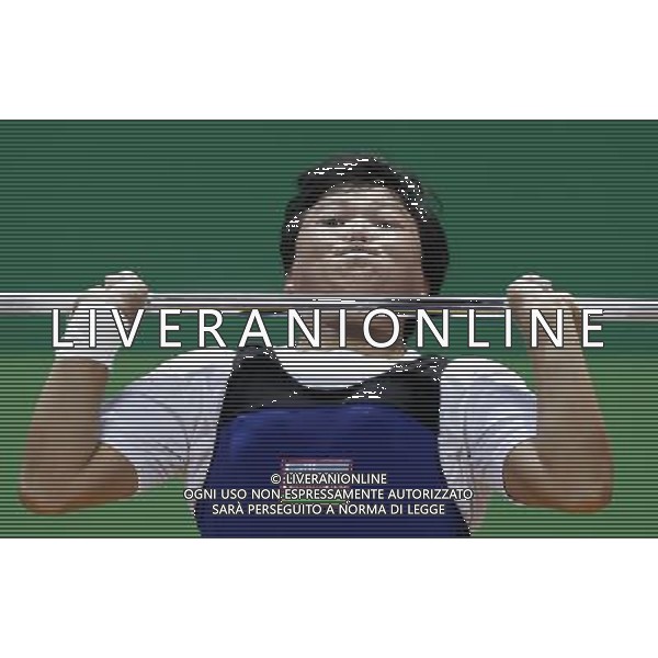 SHENZHEN, Aug. 16, 2011 Mamasaliyeva Manzurahon of Uzbekistan competes during the women\'s 63kg weightlifting competition at the 26th Summer Universiade in Shenzhen, a city of south China\'s Guangdong Province, Aug. 16, 2011. (/Wang Song)