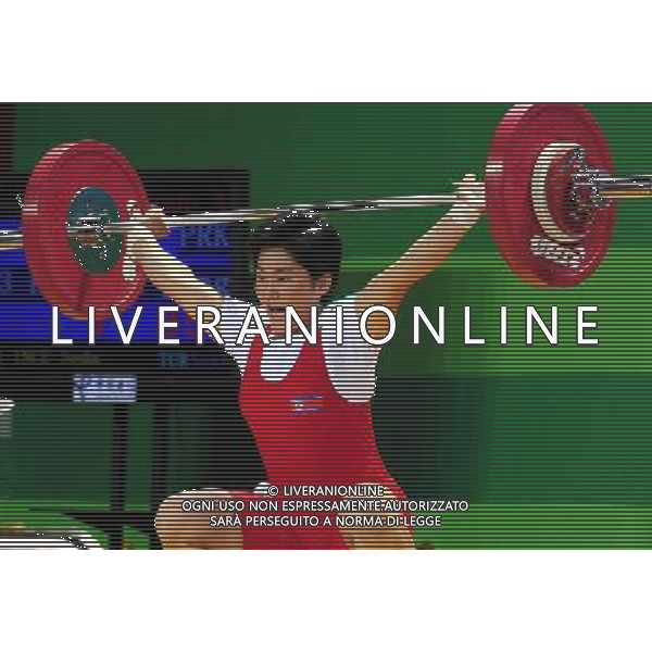 SHENZHEN, Aug. 16, 2011 Kim Yun Jong of the Democratic People\'s Republic of Korea competes during the women\'s 63kg weightlifting competition at the 26th Summer Universiade in Shenzhen, a city of south China\'s Guangdong Province, Aug. 16, 2011. Kim Yun Jong claimed the silver medal of the event with a total of 207kg. (/Wang Song)