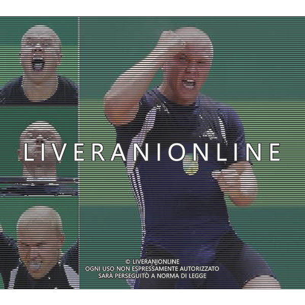 SHENZHEN, Aug. 16, 2011 The combo show Pent Leho of Estonia reacts during the men\'s 85kg weightlifting competition at the 26th Summer Universiade in Shenzhen, a city of south China\'s Guangdong Province, Aug. 16, 2011. Pent Leho ranked the 1st of group B of men\'s 85kg weightlifting with a total of 332kg. (/Wang Lili)