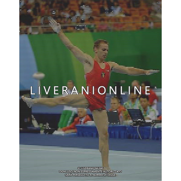 SHENZHEN, Aug. 16, 2011 Flavius Koczi of Romania competes during the men\'s floor exercise final of artistic gymnastics event at the 26th Summer Universiade, in Shenzhen, a city of south China\'s Guangdong Province, Aug. 16, 2011. Flavius Koczi won the gold medal with 15.450 points. (/Lin Yiguang)(bxf)