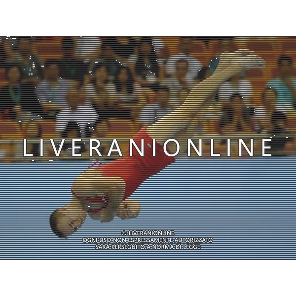 SHENZHEN, Aug. 16, 2011 Flavius Koczi of Romania competes during the men\'s floor exercise final of artistic gymnastic event at the 26th Summer Universiade, in Shenzhen, a city of south China\'s Guangdong Province, Aug. 16, 2011. Koczi Flavius won the gold medal with 15.450 points. (/Lin Yiguang)(bxf)