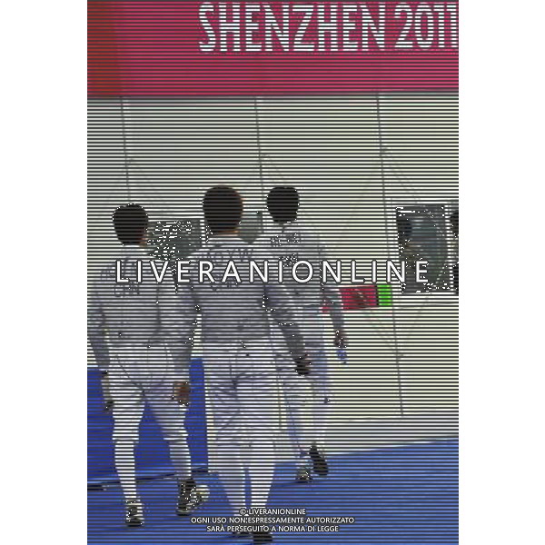 SHENZHEN, Aug. 16, 2011 China\'s Hou Mengjun£¨Xiao Yewei and He Wei (from L to R) leaves the field after the men\'s sabre team classification 5 8 match of fencing event between China and the United States at the 26th Summer Universiade, in Shenzhen, a city of south China\'s Guangdong Province, Aug. 16, 2011. China lost 41 45. (/Wang Haofei)(lm)