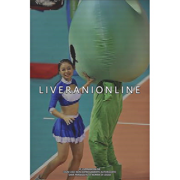 (110817) -- SHENZHEN, Aug. 17, 2011 () -- A mascot performer and a cheerleader entertain audience during match breaks in the Shenzhen Gymnasium in Shenzhen, a city of south China\'s Guangdong Province, on Aug. 16, 2011. (/Chen Yehua)
