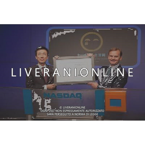 (110817) -- NEW YORK, Aug. 17, 2011 () -- Photo provided by Nasdaq shows Gary Wang (L), CEO of Tudou, China\'s second-largest online video site Tudou Holdings Ltd., attending a ceremony at Nasdaq, New York, Aug. 17, 2011. Tudou on Wednesday issued shares on Nasdaq Stock Market, just one week after the markets underwent a huge turbulence following the downgrade of U.S. credit rating. () (wjd)