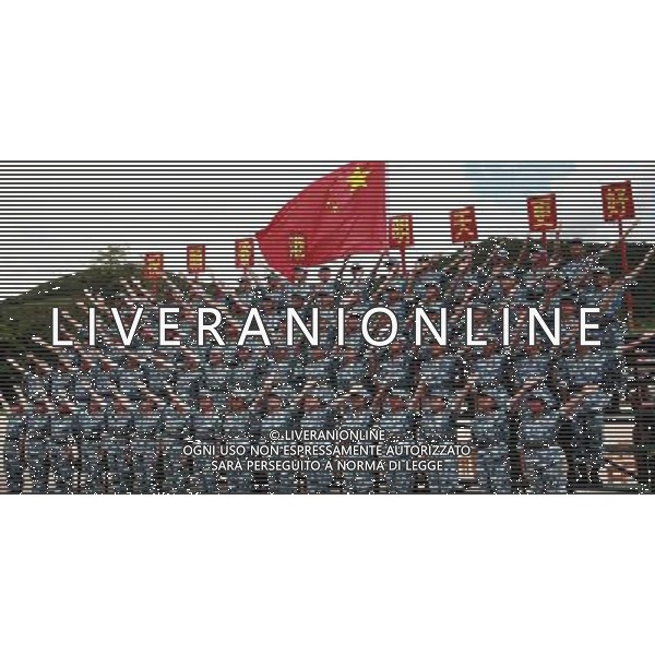 (110817) -- HONG KONG, Aug. 17, 2011 () -- Student trainees perform on stage during the closing ceremony of a military camp in Hong Kong, south China, Aug. 17, 2011. A total of 100 students from Hong Kong-based colleges and universities finished a ten-day summer military camp here Wednesday. (/Ma Zheng) (ljh)