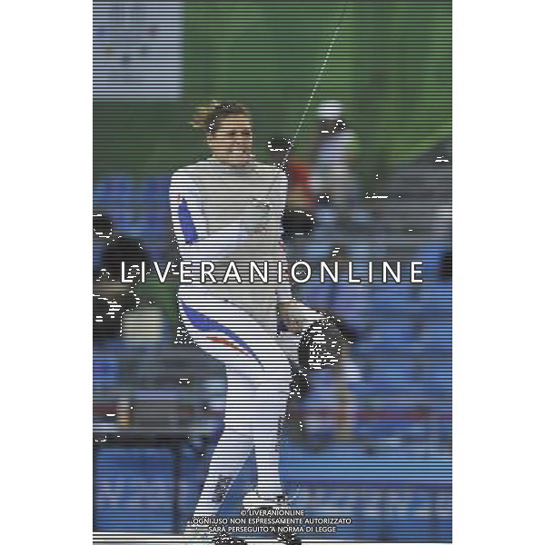 (110817) -- SHENZHEN, Aug. 17, 2011 () -- Berangere Genevois of France celebrates during the bronze medal match of women\'s foil team of fencing at the 26th Summer Universiade in Shenzhen, a city of south China\'s Guangdong Province Aug. 17, 2011. Team France won the bronze by beating team South Korea with 45-41. (/Wang Haofei)(wll)