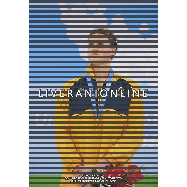 (110816) -- SHENZHEN, Aug. 16, 2011 () -- David Mckeon of Australia powers poses at the awarding cermony of the men\'s 400m freestyle of swimming at the 26th Summer Universiade in Shenzhen, a city of south China\'s Guangdong Province, Aug. 16, 2011. David Mckeon claimed the title of the event with a time of 3:48.78. (/Liang Xu)