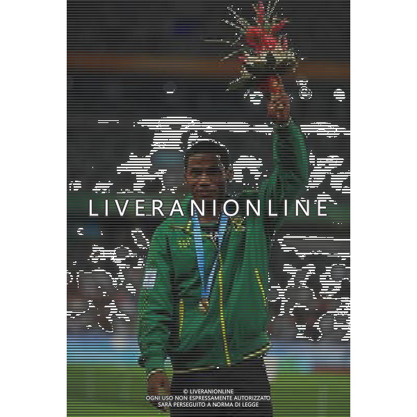 (110817) -- SHENZHEN, Aug. 17, 2011 () -- Jacques Harvey of Jamaica celebrates on the podium during the awarding ceremony for the men\'s 100m of athletics at the 26th Summer Universiade in Shenzhen, a city of south China\'s Guangdong Province Aug. 17, 2011. Jacques Harvey claimed the title with 10.14 seconds. (/Gong Lei)(wll)
