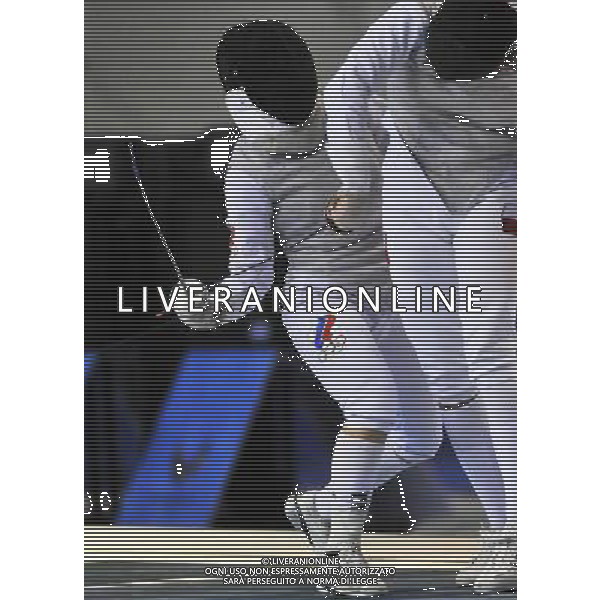 (110817) -- SHENZHEN, Aug. 17, 2011 () -- Viktoria Kozyreva (L) of Russia competes during the gold medal match of women\'s foil team of fencing at the 26th Summer Universiade in Shenzhen, a city of south China\'s Guangdong Province Aug. 17, 2011. Team Russia claimed the title by beating team Poland with 45-32. (/Wang Haofei)(wll)