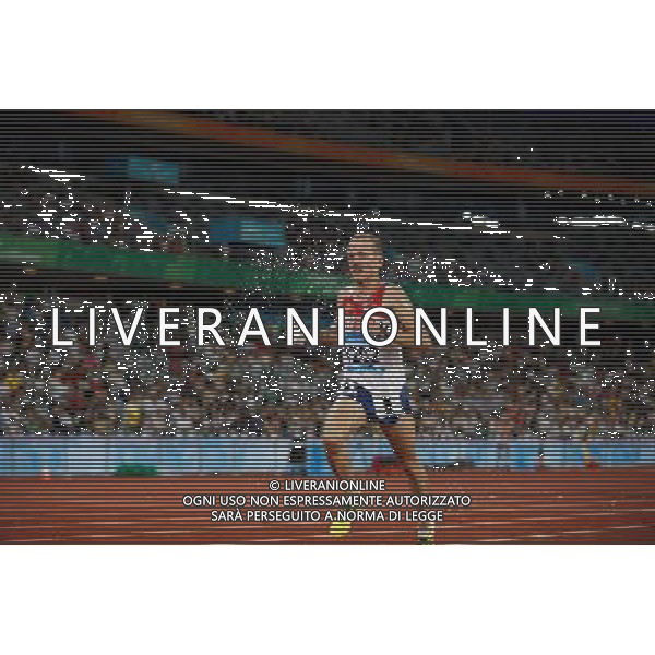 (110817) -- SHENZHEN, Aug. 17, 2011 () -- Sergey Rybin of Russia competes during the final of the men\'s 10,000m of athletics at the 26th Summer Universiade in Shenzhen, a city of south China\'s Guangdong Province Aug. 17, 2011. Sergey Rybin fell down to the field in the last lap and was taken out by medical staff. Rybin did not finish the race. (/Li Ming)(wll)