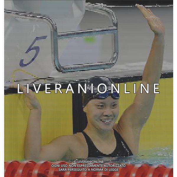 (110817) -- SHENZHEN, Aug. 17, 2011 () -- Sakai Shiho of Japan (R) celebrates after finishing the women\'s 100m backstroke final of swimming at the 26th Summer Universiade in Shenzhen, a city of south China\'s Guangdong Province, Aug. 17, 2011. Sakai Shiho claimed the gold of the event with a time of 1:00.28 seconds. (/Liang Xu)