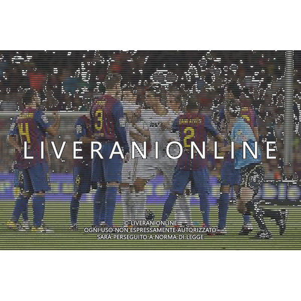 FC Barcelona\'s Javier Mascherano, Gerard Pique, Daniel Alves and Sergio Busquets have words with Real Madrid\'s Pepe, Xabi Alonso, Cristiano Ronaldo and Fabio Coentrao during Spanish Supercup 2nd match.August 17,2011. Photo: Acero / Alter / ALFAQUI Photo: Acero / Alter / ALFAQUI