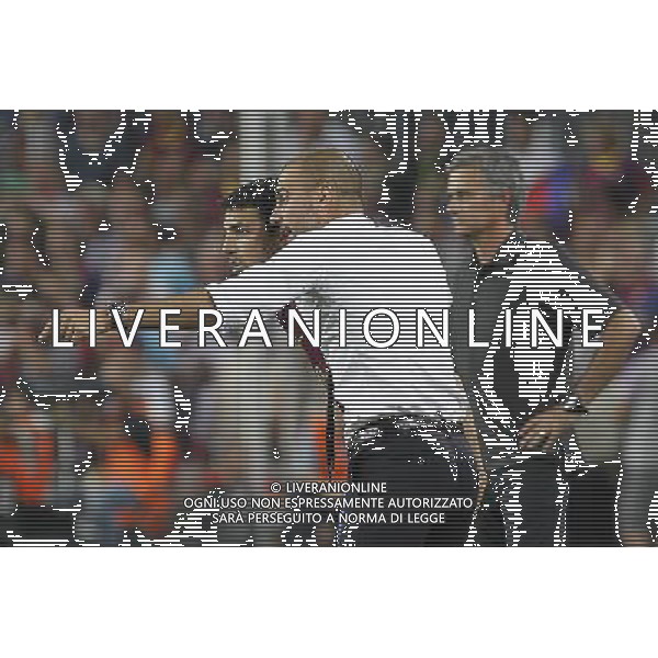 FC Barcelona\'s coach coach Pep Guardiola and Cesc Fabregas (l) in presence of Real Madrid\'s coach Jose Mourinho during Spanish Supercup 2nd match.August 17,2011. Photo: Acero / Alter / ALFAQUI Photo: Acero / Alter / ALFAQUI