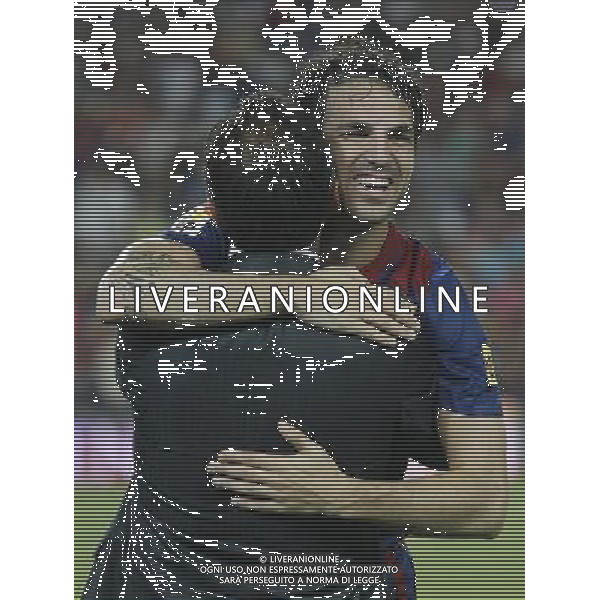 FC Barcelona\'s Cesc Fabregas and the Public Relations of FC Barcelona Manuel Estiarte (b) celebrates the victory during Spanish Supercup 2nd match.August 17,2011. Photo: Acero / Alter / ALFAQUI Photo: Acero / Alter / ALFAQUI