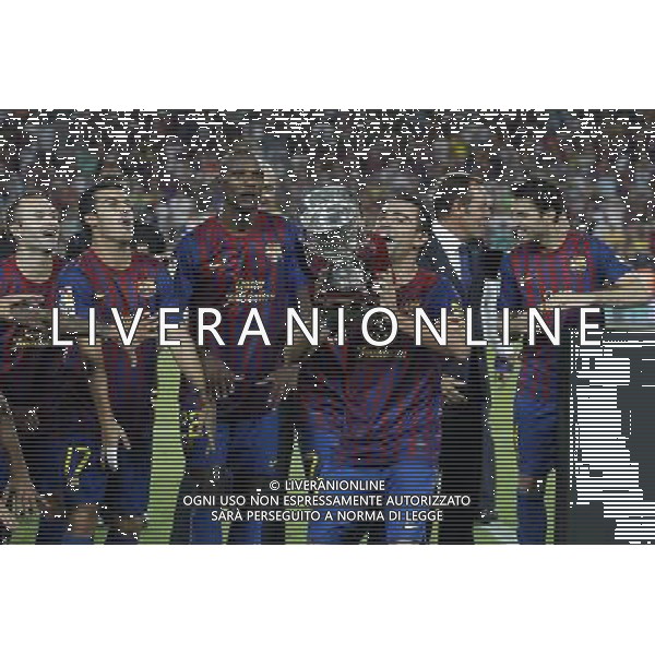 FC Barcelona\'s Andres Iniesta, Pedro Rodriguez, Eric Abidal, Xavi Hernandez, Sandro Rossell and Cesc Fabregas celebrates the victory during Spanish Supercup 2nd match.August 17,2011. Photo: Acero / Alter / ALFAQUI Photo: Acero / Alter / ALFAQUI