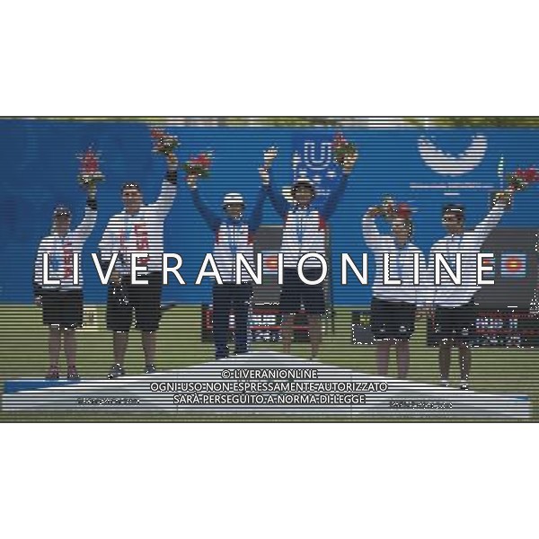 (110818) -- SHENZHEN, Aug. 18, 2011 () -- Gold medalists Min Lihong and Seo Jung Hee of South Korea, silver medalists Kendal Nicely and Zachary Plannick of the United States and bronze medalists Anastasia Anastasio and Jacopo Polidori of Italy pose for group photos during the awarding ceremony of mixed team compound of archery at the 26th Summer Universiade in Shenzhen, a city of south China\'s Guangdong Province, on Aug. 18, 2011. (/Lui Siu Wai)(wx)