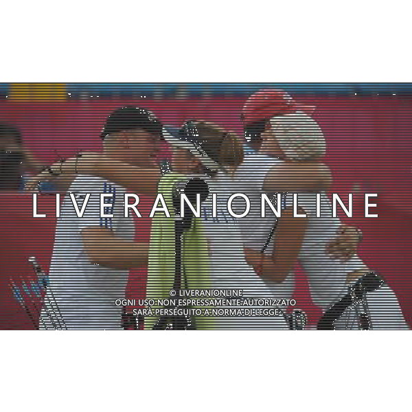 (110818) -- SHENZHEN, Aug. 18, 2011 () -- Members of France\'s team celebrate during men\'s team compound of archery at the 26th Summer Universiade in Shenzhen, a city of south China\'s Guangdong Province, on Aug. 18, 2011. French team won the gold medal in the match. (/Lui Siu Wai)(wx)