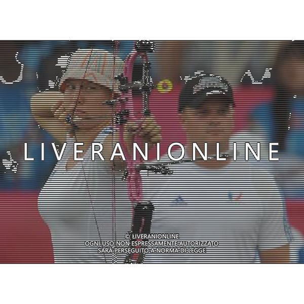 (110818) -- SHENZHEN, Aug. 18, 2011 () -- Pascale Lebecque of France competes during men\'s team compound of archery at the 26th Summer Universiade in Shenzhen, a city of south China\'s Guangdong Province, on Aug. 18, 2011. French team won the gold medal in the match. (/Lui Siu Wai)(wx)