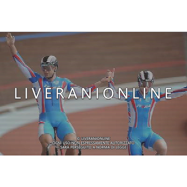 (110818) -- SHENZHEN, Aug. 18, 2011 () -- Denis Dmitriev (L) of Russia and his compatriot Pavel Yakushevskiy celebrate after men\'s sprint of cycling track at the 26th Summer Universiade in Shenzhen, a city of south China\'s Guangdong Province, on Aug. 18, 2011. Dmitriev won the gold medal and Yakushevskiy got the silver in the match. (/Li Ga)(wx)