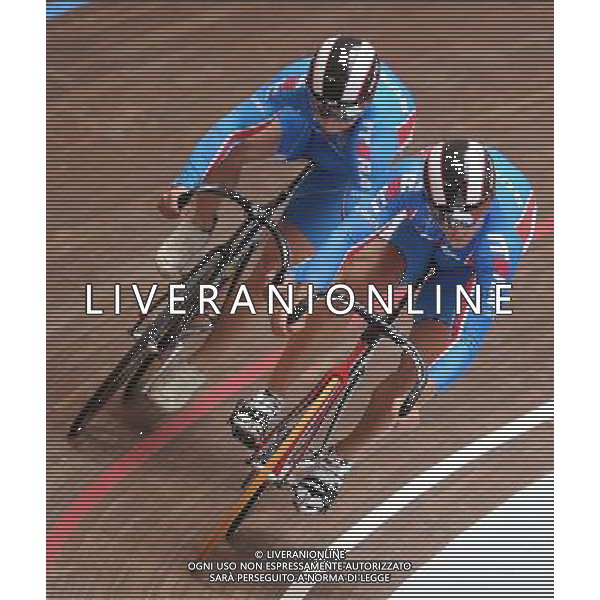(110818) -- SHENZHEN, Aug. 18, 2011 () -- Denis Dmitriev (R) of Russia and his compatriot Pavel Yakushevskiy compete during men\'s sprint of cycling track at the 26th Summer Universiade in Shenzhen, a city of south China\'s Guangdong Province, on Aug. 18, 2011. Dmitriev won the gold medal and Yakushevskiy got the silver in the match. (/Li Ga)(wx)