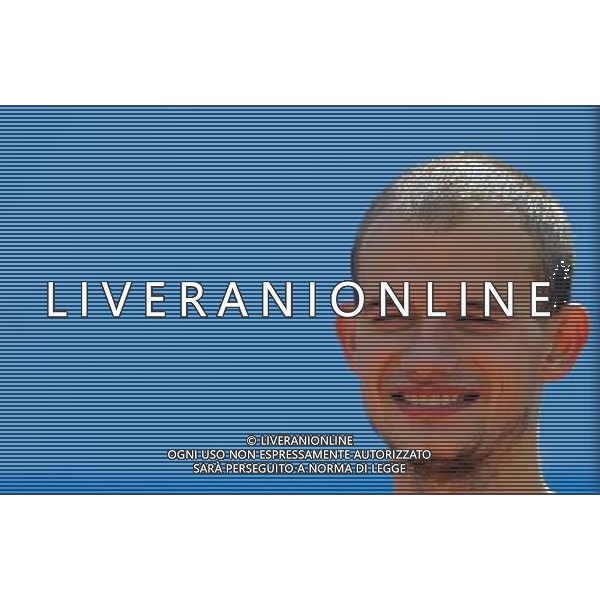 (110818) -- SHENZHEN, Aug. 18, 2011 () -- Andrey Krivov of Russia smiles during the flower ceremony for men\'s 20km walk of athletics at the 26th Summer Universiade in Shenzhen, a city of south China\'s Guangdong Province, on Aug. 18, 2011. Andrey Krivov claimed the gold medal with 1 hour 24 minutes 15 seconds. (/Li Ming)(wx)
