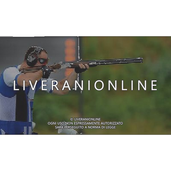 (110818) -- SHENZHEN, Aug. 18, 2011 () -- Simone Lorenzo Prosperi of Italy shoots during men\'s trap of shotgun at the 26th Summer Universiade in Shenzhen, a city of south China\'s Guangdong Province, on Aug. 18, 2011. Shotgun match kicked off at the Longgang Shotgun Range Thursday morning. (/Lin Yiguang)(wx)