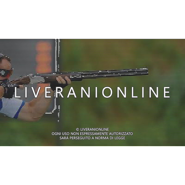 (110818) -- SHENZHEN, Aug. 18, 2011 () -- Simone Lorenzo Prosperi of Italy shoots during men\'s trap of shotgun at the 26th Summer Universiade in Shenzhen, a city of south China\'s Guangdong Province, on Aug. 18, 2011. Shotgun match kicked off at the Longgang Shotgun Range Thursday morning. (/Lin Yiguang)(wx)