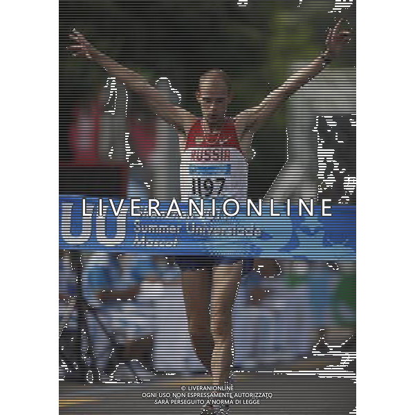 (110818) -- SHENZHEN, Aug. 18, 2011 () -- Andrey Krivov of Russia crosses the finish line during men\'s 20km walk of athletics at the 26th Summer Universiade in Shenzhen, a city of south China\'s Guangdong Province, on Aug. 18, 2011. Andrey Krivov claimed the gold medal with 1 hour 24 minutes 15 seconds. (/Li Ming)(wx)