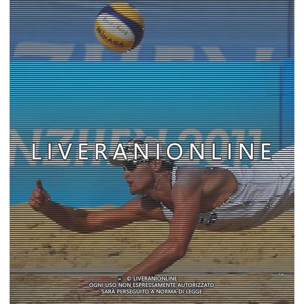 (110818) SHENZHEN, Aug. 18, 2011 Poland\'s Jakub Szalankiewic saves the ball during the men\'s beach volleyball final against Prokopyev/Yory of Russia at the 26th Summer Universiade, in Shenzhen, a city of south China\'s Guangdong Province, Aug. 18, 2011. Kadziola/Szalankiewic won 2 1 to claim the title. (/Gong Lei)(bxf)