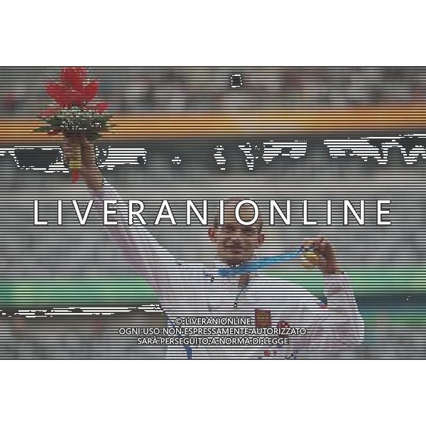 (110818) SHENZHEN, Aug. 18, 2011 Gold medalist Andrey Krivov of Russia celebrates during awarding ceremony for the men\'s 20km walk individual final of athletics event at the 26th Summer Universiade, in Shenzhen, a city of south China\'s Guangdong Province, Aug. 18, 2011. Krivov won the title of the event with 1 hours 24 minutes 15 seconds. (/Liao Yujie) (bxf)