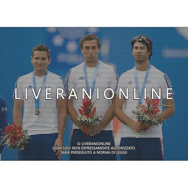 (110818) SHENZHEN, Aug. 18, 2011 Bronze medalists team of France celebrate during the awarding ceremony for the men\'s team recurve bow match of archery event at the 26th Summer Universiade, in Shenzhen, a city of south China\'s Guangdong Province, Aug. 18, 2011. (/Lui Siu Wai)(bxf)