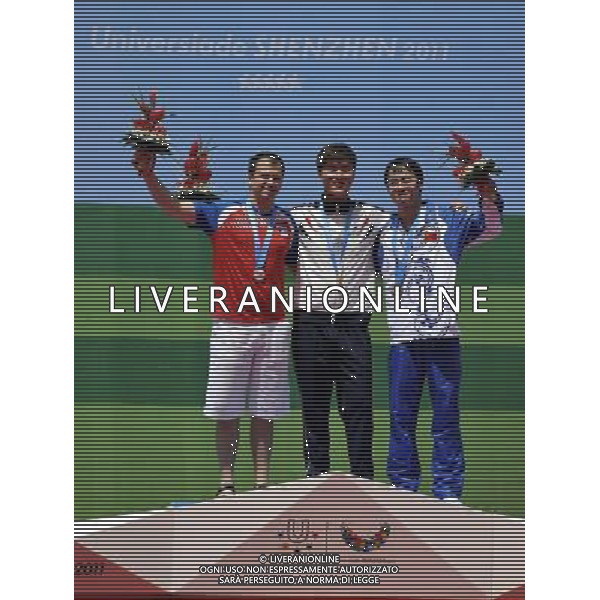 (110818) SHENZHEN, Aug. 18, 2011 Gold medalist Lee Dae Myung of South Korea, silver medalist Mikec Damir of Serbia, bronze medalist Mai Jiajie of China celebrate during the awarding ceremony for the men\'s 50m pistol individual of shooting event at the 26th Summer Universiade, in Shenzhen, a city of south China\'s Guangdong Province, Aug. 18, 2011. (/Chen Yehua)(bxf)