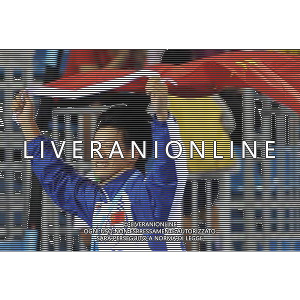 (110818) SHENZHEN, Aug. 18, 2011 Zhu Yuxiang of China celebrates after the final of men\'s individual poomsae of taekwondo at the 26th Summer Universiade in Shenzhen, a city of south China\'s Guangdong Province Aug. 18, 2011. Zhu Yuxiang claimed the title with 8.65 points. (/Liang Xu)(wll)