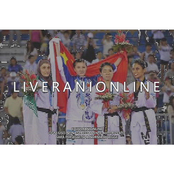 (110818) SHENZHEN, Aug. 18, 2011 Gold medalist Zhang Jingjing (2nd L) of China, silver medalist Mahsa Mardani (1st L) of Iran, bronze medalists Park Ji Young (2nd R)of South Korea and Ollin Medina of Mexico celebrate during the awarding ceremony for women\'s individual poomsae of taekwondo at the 26th Summer Universiade in Shenzhen, a city of south China\'s Guangdong Province Aug. 18, 2011. (/Liang Xu)(wll)