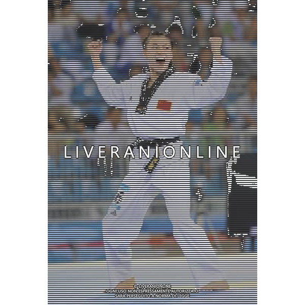 (110818) SHENZHEN, Aug. 18, 2011 Zhang Jingjing of China competes during the final of women\'s individual poomsae of taekwondo at the 26th Summer Universiade in Shenzhen, a city of south China\'s Guangdong Province Aug. 18, 2011. Zhang Jingjing claimed the title with 8.58 points. (/Liang Xu)(wll)