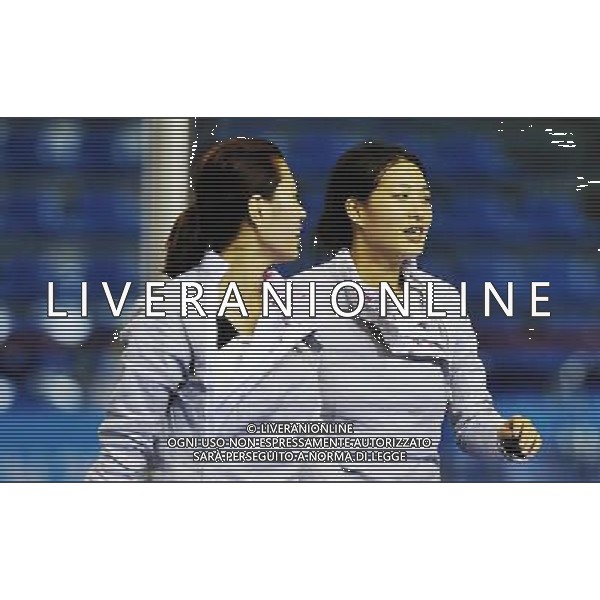 (110818) SHENZHEN, Aug. 18, 2011 Choi Sooyeon (R) of South Korea smiles after the women\'s sabre team bronze medal match against Romania at the 26th Summer Universiade in Shenzhen, a city of south China\'s Guangdong Province, Aug. 18, 2011. Team South Korea won the match 45:29 and claimed the bronze medal of the event. (/Wang Haofei)