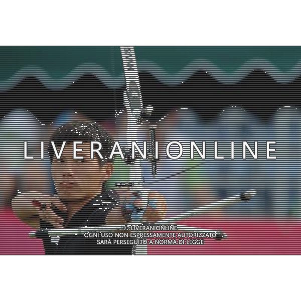 (110818) SHENZHEN, Aug. 18, 2011 Chang Liang of China competes during the final of men\'s team recurve of archery at the 26th Summer Universiade in Shenzhen, a city of south China\'s Guangdong Province Aug. 18, 2011. Team China claimed the title by beating team Japan with 18 15. (/Lui Siu Wai)(wll)