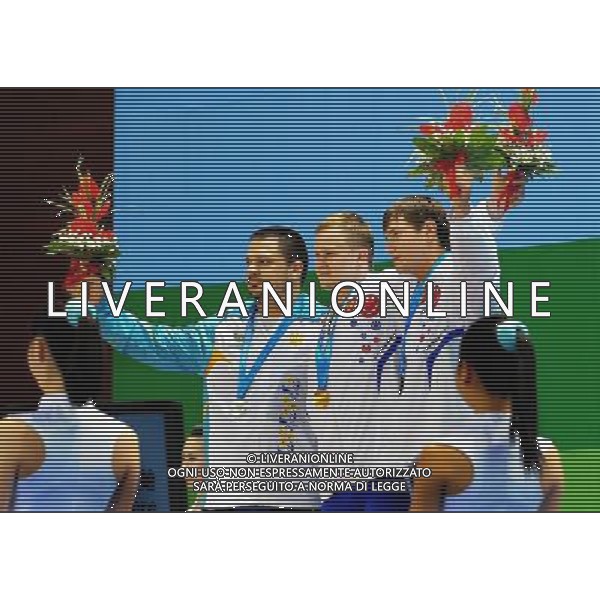 (110816) SHENZHEN, Aug. 16, 2011 Gold medalist Gennady Muratov of Russia (C), silver medalist Mykola Hordiychuk of Ukraine (L) and bronze medalist Aleksey Lovchuk of Russia celebrate during the awarding ceremony for the men\'s 105KG weightlifting at the 26th Summer Universiade, in Shenzhen, a city of south China\'s Guangdong Province, Aug. 16, 2011. Muratov claimed the title of the event with 400KG. (/Wang Song)(bxf)