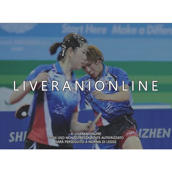 (110816) SHENZHEN, Aug. 18, 2011 South Korea\'s Kim So Ri (L) and Lee Jae Hun compete during the mixed doubles semifinals of table tennis event against China\'s Shang Kun and Rao Jingwen at the 26th Summer Universiade, in Shenzhen, a city of south China\'s Guangdong Province, Aug. 18, 2011. Kim and Lee lost 2 4. (/Yang Shiyao)(bxf)