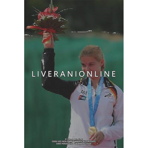 (110818) SHENZHEN, Aug. 18, 2011 Jana Beckmann of Germany gestures at the awarding ceremony of trap women event of shotgun at the 26th Summer Universiade in Shenzhen, a city of south China\'s Guangdong Province, Aug. 18, 2011. Jana Beckmann claimed the gold medal of the event with a total of 94 hits. (/Lin Yiguang)