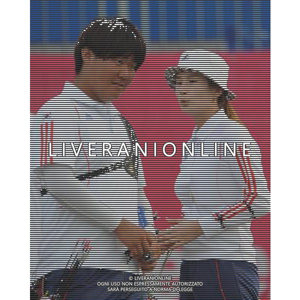 (110818) SHENZHEN, Aug. 18, 2011 South Korea\'s Kim Bubmin (L) and Ki Bo Bae react during the mix team recurve bow final of archery event at the 26th Summer Universiade, in Shenzhen, a city of south China\'s Guangdong Province, Aug. 18, 2011. South Korea defeated Chinese Taipei 15 10 to claim the title. (/Lui Siu Wai)(bxf)