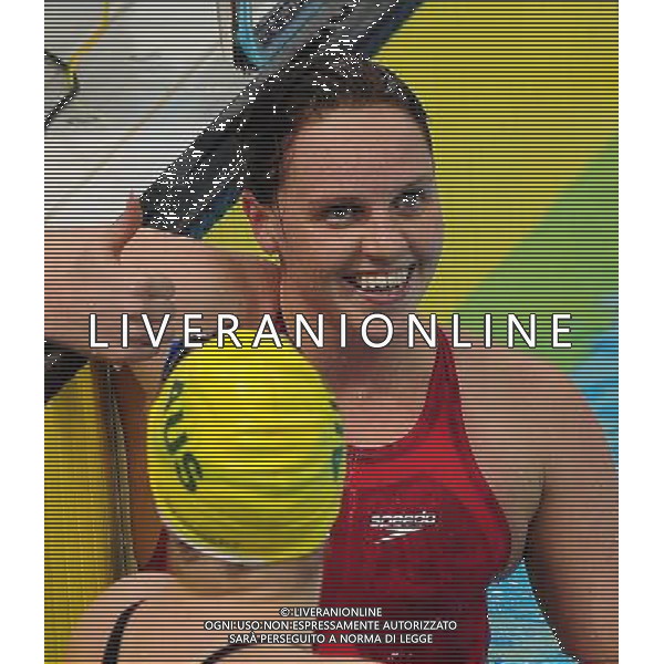 (110818) SHENZHEN, Aug. 18, 2011 Jessica Dickons of Great Britain smiles after finishing the women\'s 200m butterfly final of swimming at the 26th Summer Universiade in Shenzhen, a city of south China\'s Guangdong Province, Aug. 18, 2011. Jessica Dickons claimed the gold of the event with a time of 2:08.91. (/Lu Hanxin)