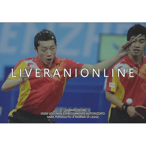 (110818) SHENZHEN, Aug. 18, 2011 China\'s Xu Xin (L) and Yan An compete during the men\'s doubles quarterfinal of table tennis event against Chinese Taipei\'s Huang S/Shen C at the 26th Summer Universiade, in Shenzhen, a city of south China\'s Guangdong Province, Aug. 18, 2011. Xu X/Yan A won 4 0. (/Yang Shiyao)(bxf)