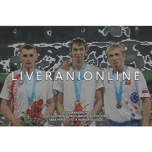 (110818) -- SHENZHEN, Aug. 18, 2011 () -- Gold medalist Bogdan Bondarenko of Ukraine (C), silver medalist Wojciech Theiner of Poland (L) and bronze medalist Sergey Mudrov of Russia celebrate during the awarding ceremony for the the men\'s high jump final of athletics event at the 26th Summer Universiade, in Shenzhen, a city of south China\'s Guangdong Province, Aug. 18, 2011. (/Li Ming) (bxf)