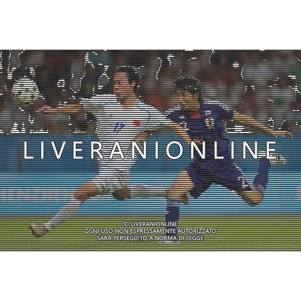 (110818) -- SHENZHEN, Aug. 18, 2011 () -- Fan Zhiqiang of China (L) vies during the men\'s football quarterfinal against Japan at the 26th Summer Universiade, in Shenzhen, a city of south China\'s Guangdong Province, Aug. 18, 2011. Japan won 3-2 to enter the semifinals. (/Li Ga)(bxf)