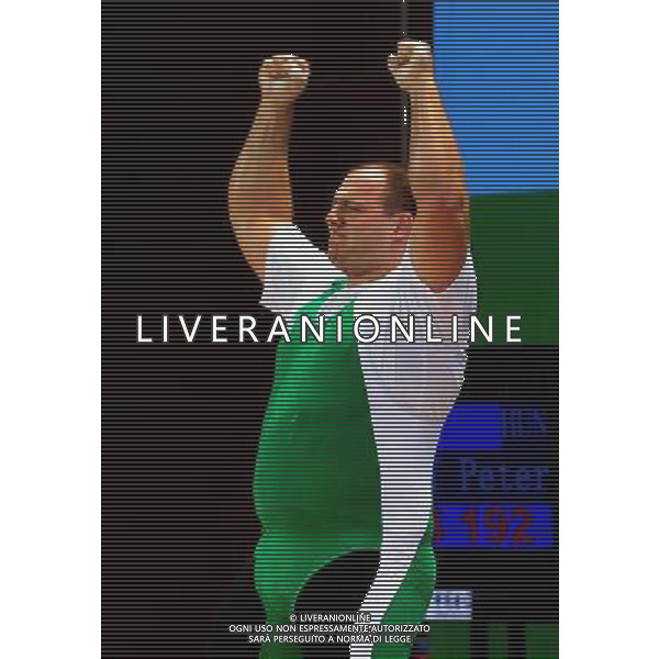 (110818) -- SHENZHEN, Aug. 18, 2011 () -- Peter Nagy of Hungary reacts during the men\'s +150kg weightlifting competition at the 26th Summer Universiade in Shenzhen, a city of south China\'s Guangdong Province, Aug. 18, 2011. Peter Nagy took the silver with a total of 412kg. (/Wang Song)