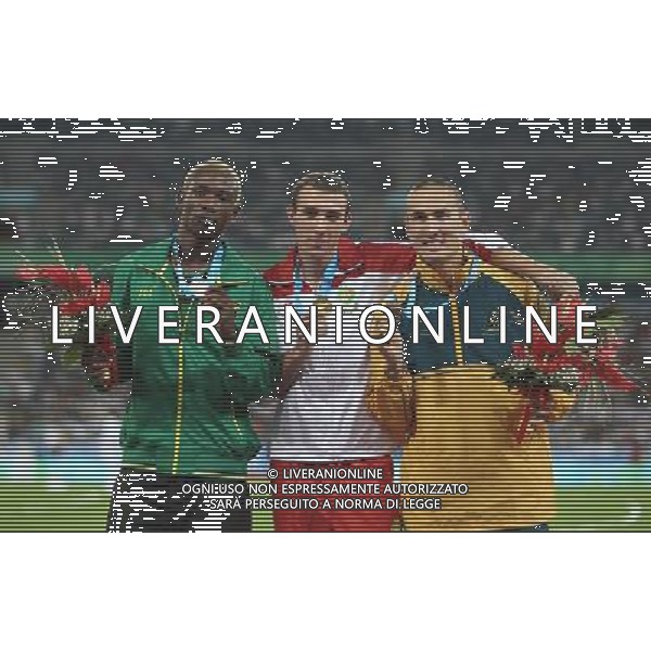 (110818) -- SHENZHEN, Aug. 18, 2011 () -- Gold medalist Marcell Deak Nagy of Hungary (C), silver medalist Peter Matthews of Jamaica (L) and bronze medalist Sean Wroe of Australia celebrate during the awarding ceremony for the men\'s 400M race of athletics event at the 26th Summer Universiade, in Shenzhen, a city of south China\'s Guangdong Province, Aug. 18, 2011. (/Liao Yujie) (bxf) /Universiadi Estive 2011 a Shenzhen , Cina - AG. ALDO LIVERANI SAS- ITALY ONLY *** Local Caption *** .